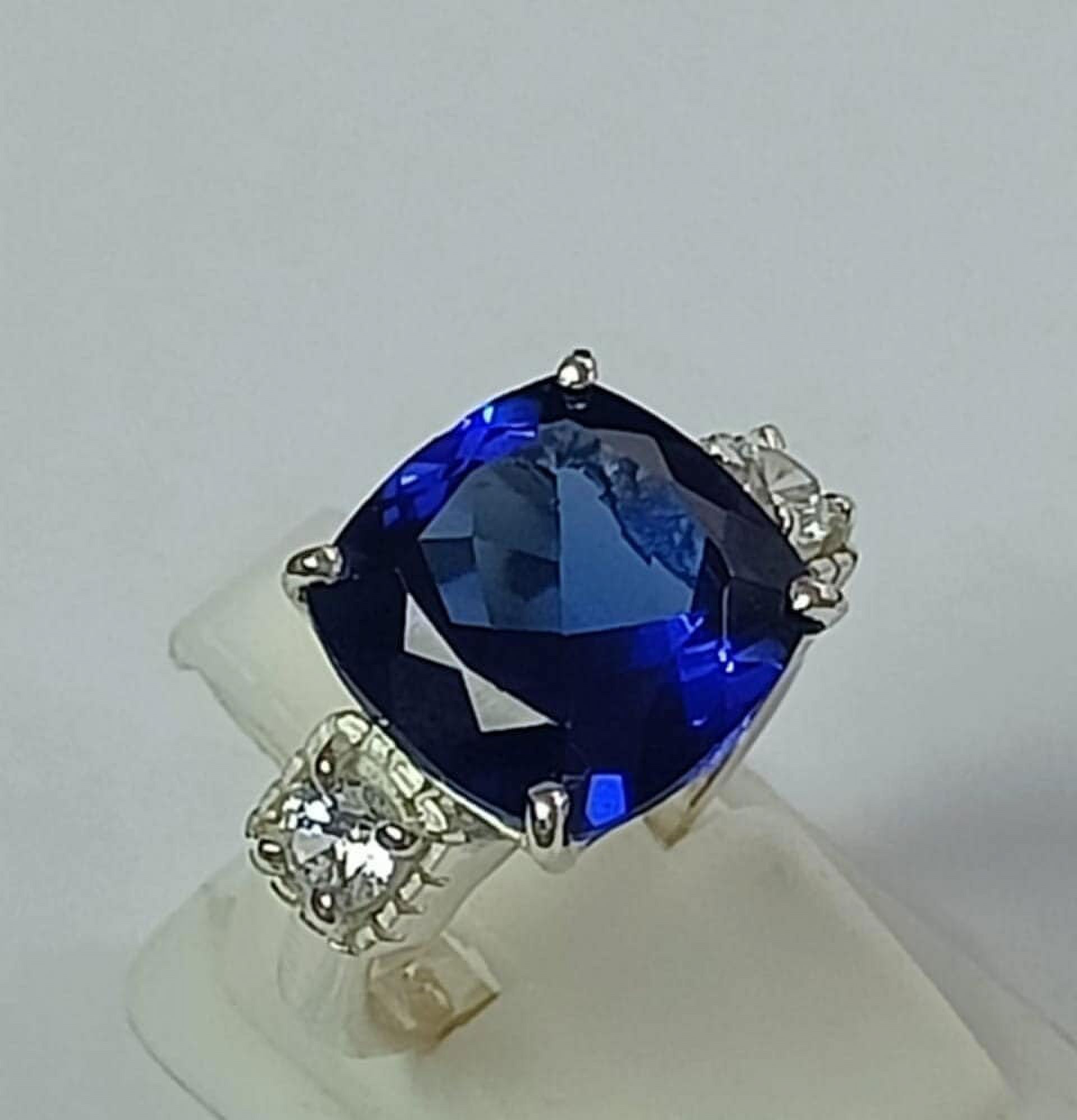 3 carat elongated cushion lab-created blue sapphire with two flanking Blue White Sapphire Elongated Cushion Engagement Ring