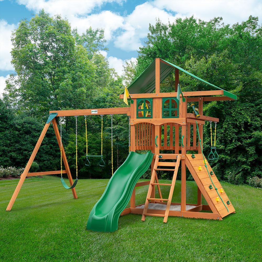 Gorilla Playsets 01-1080 Avalon Treehouse Wooden Swing Set with Oversized Green Vinyl Canopy Roof, Trapeze Arm, Climbing Wall, Ladder, Swings and Slide