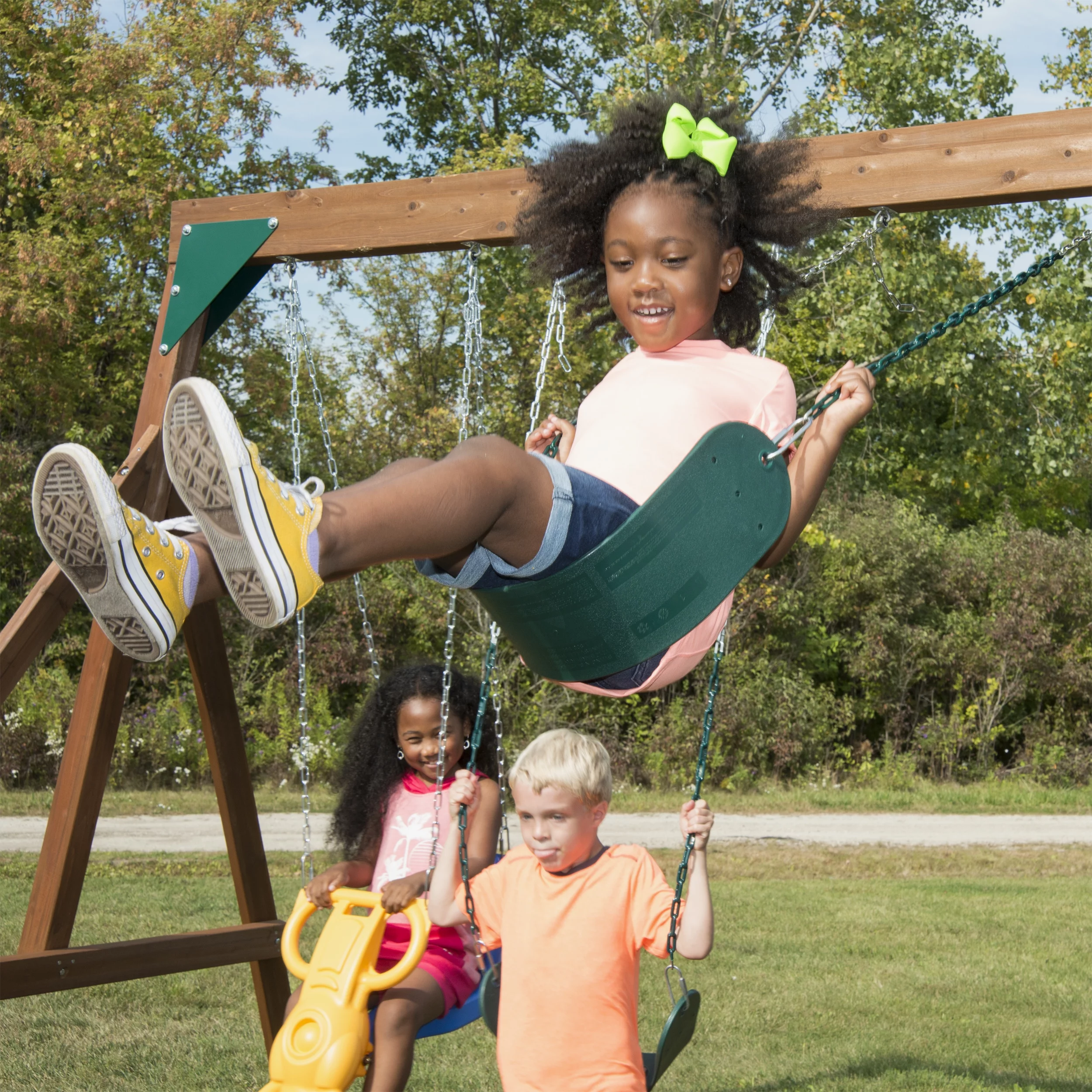 Swing-N-Slide Knightsbridge Wooden Backyard Swing Set with Alpine Wave Slide, Glider Swing, and Rock Climbing Wall