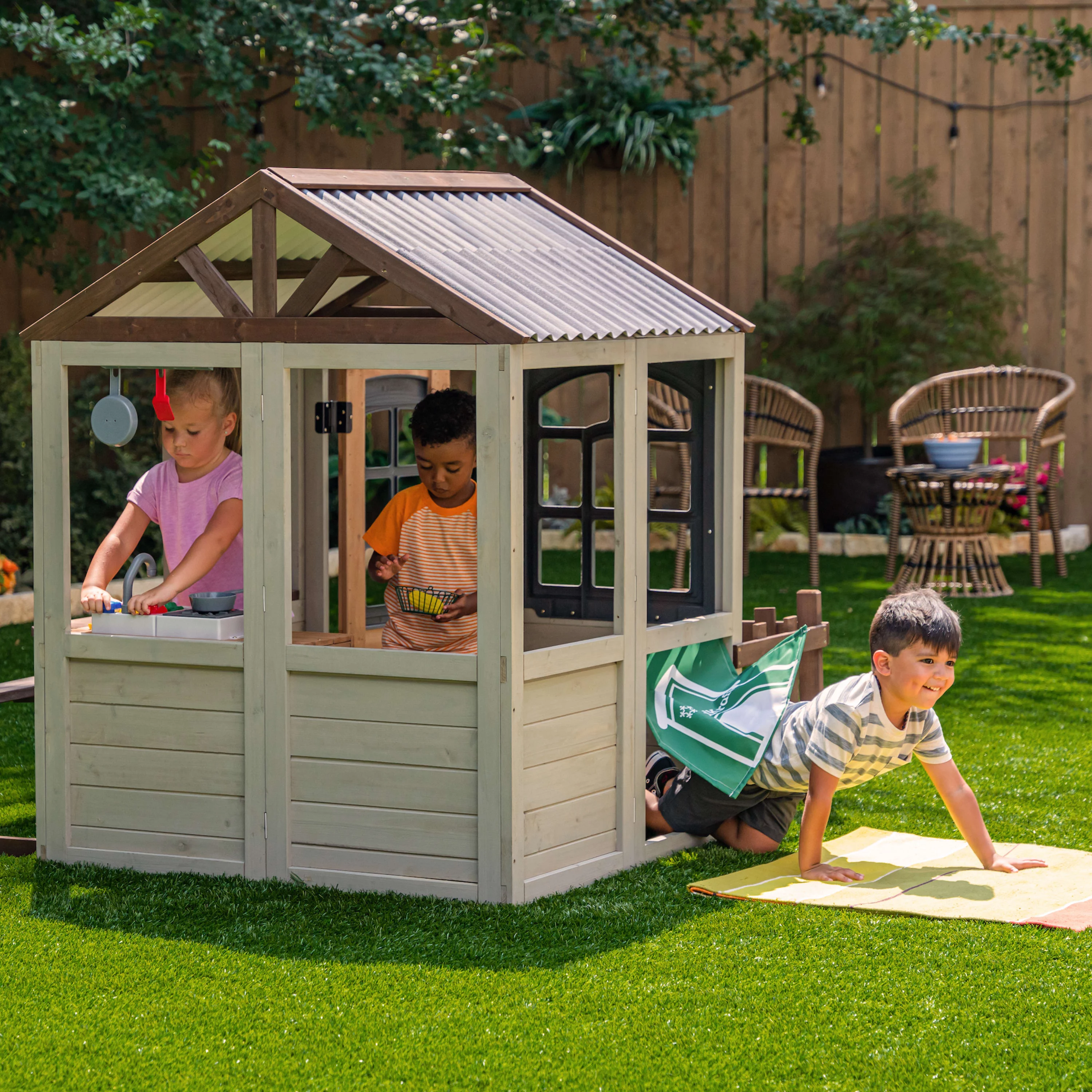 KidKraft Pioneer Cottage Wooden Outdoor Playhouse with Doorbell and 13 Pieces