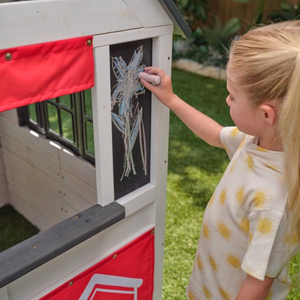 KidKraft Riverscape Wooden Playhouse with Working Doorbell, Fence, Kitchen and Pet Door