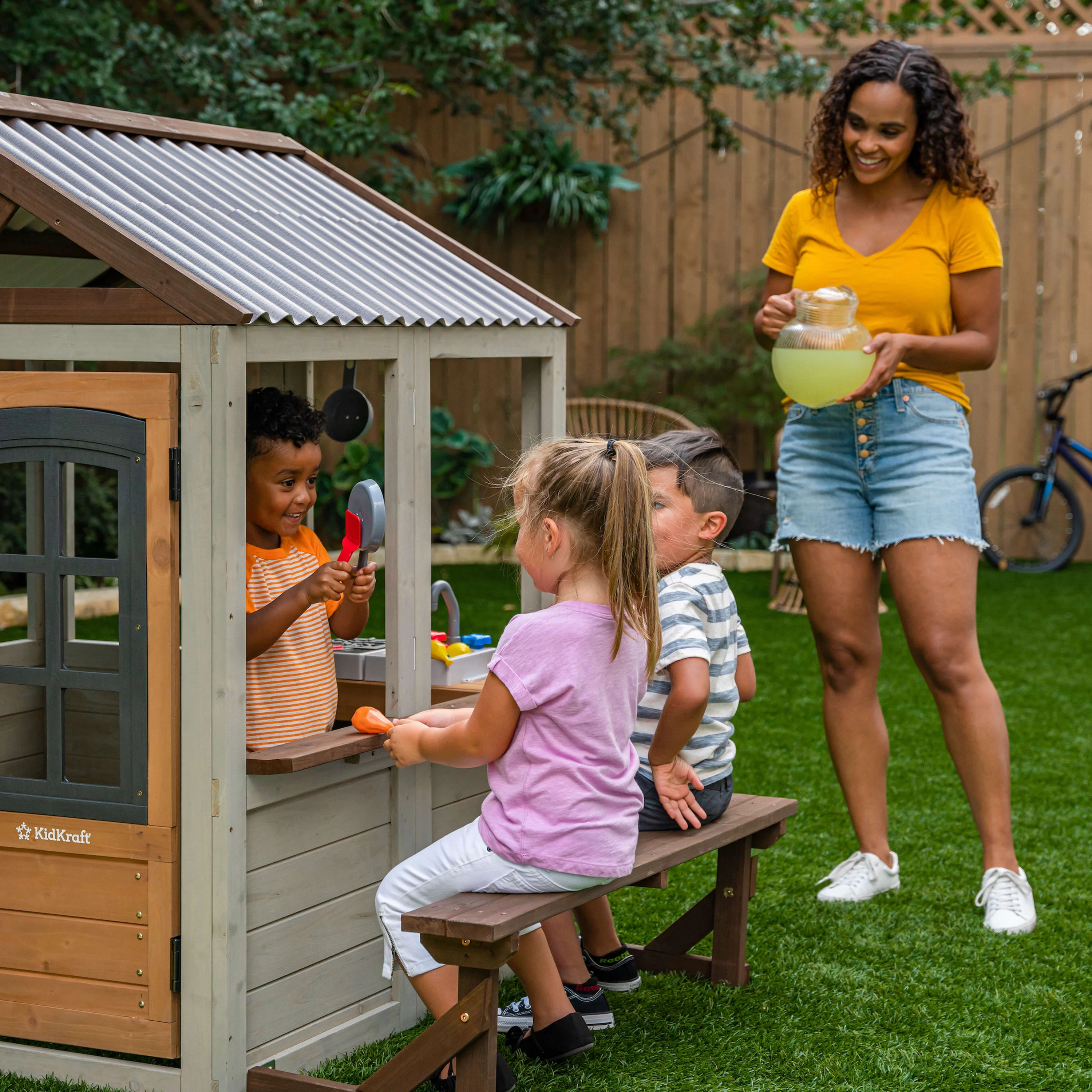 KidKraft Pioneer Cottage Wooden Outdoor Playhouse with Doorbell and 13 Pieces