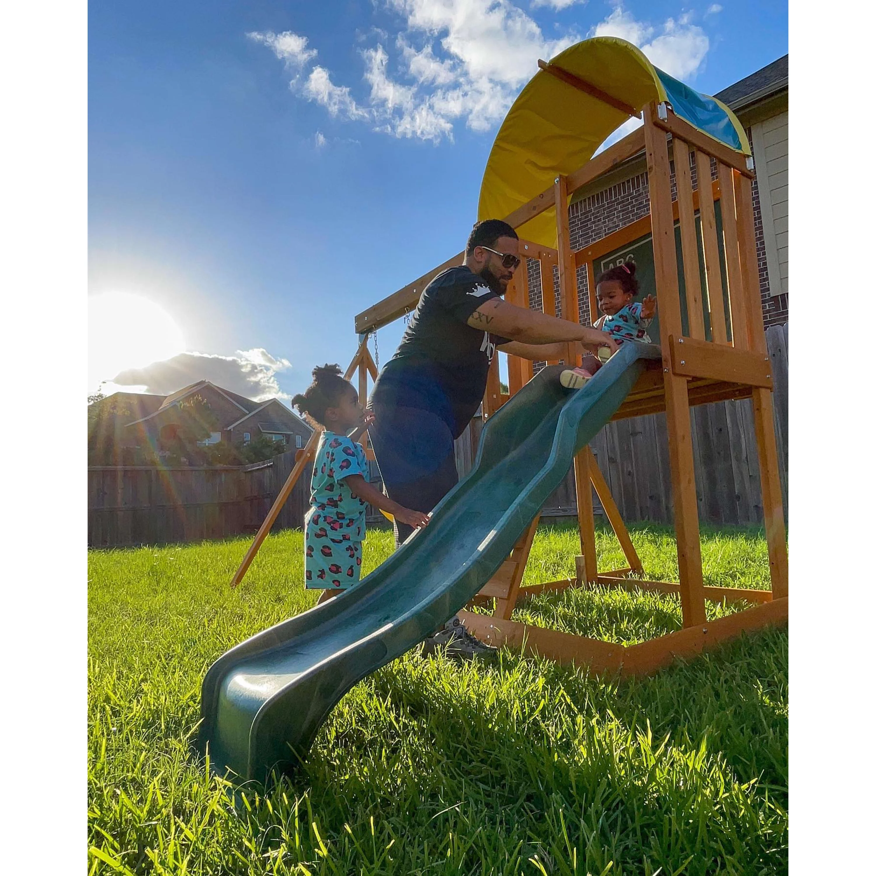 KidKraft Ainsley Wooden Outdoor Swing Set with Slide and Rock Wall
