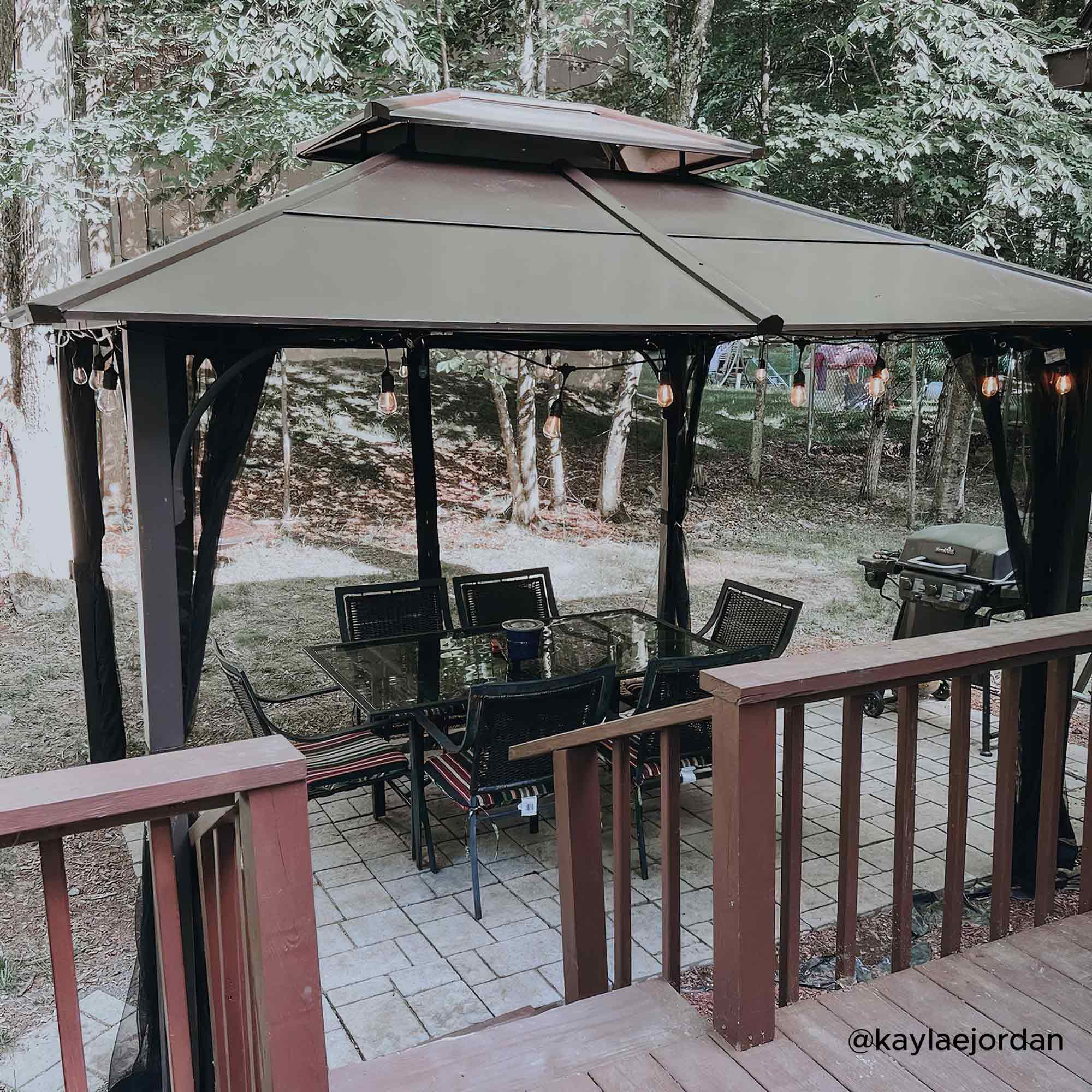 Sunjoy Lindsay Outdoor Patio 10x12 ft. Brown Steel Frame 2-Tier Hardtop Roof Gazebo with Ceiling hook and Netting