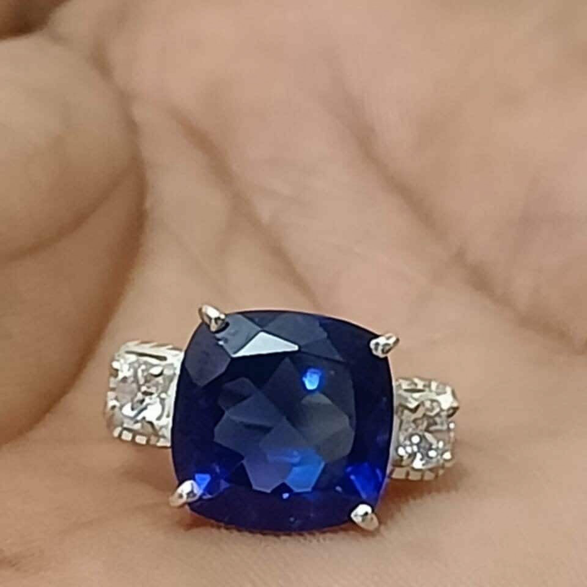 3 carat elongated cushion lab-created blue sapphire with two flanking Blue White Sapphire Elongated Cushion Engagement Ring