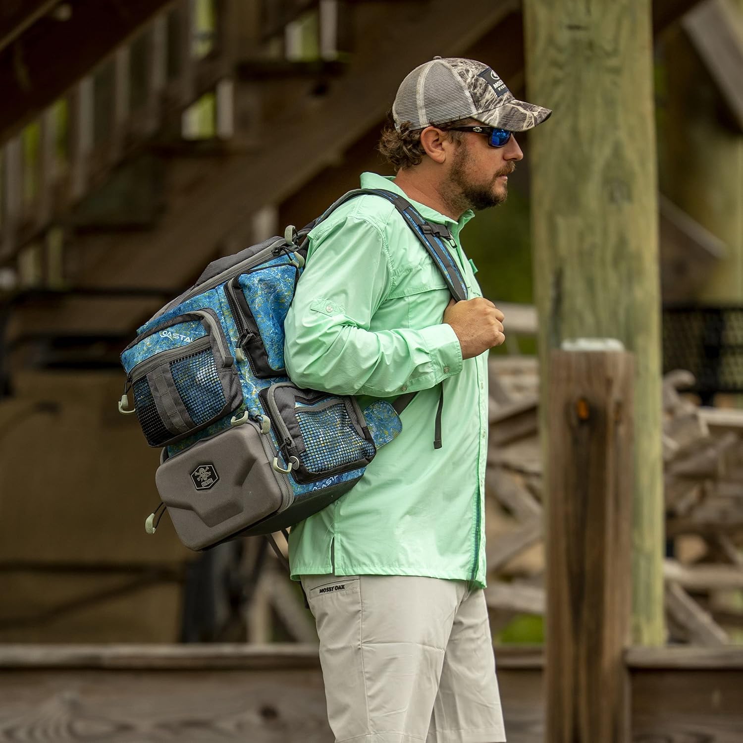 Calcutta Squall Tactical Tackle Backpack | Mossy Oak Shoreline Pattern | 3 3600 Tackle Trays | Durable Fishing Tackle Bag | Padded Backpack Straps | 2 Leader Wheel Pockets