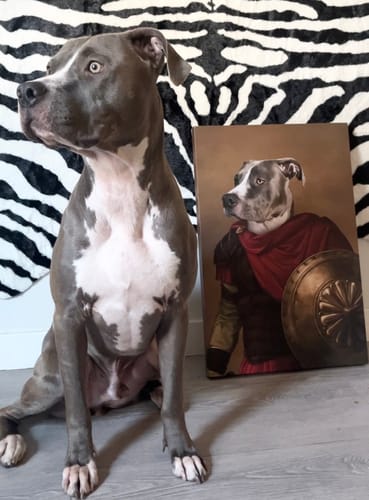 A dog beside its custom royal pet portrait