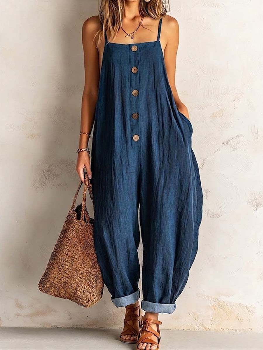 Loose-fit Cotton Jumpsuit Featuring Spaghetti Straps, A Button-front Placket With Wooden Buttons, Rolled Hems, And Cinched Cuffs.