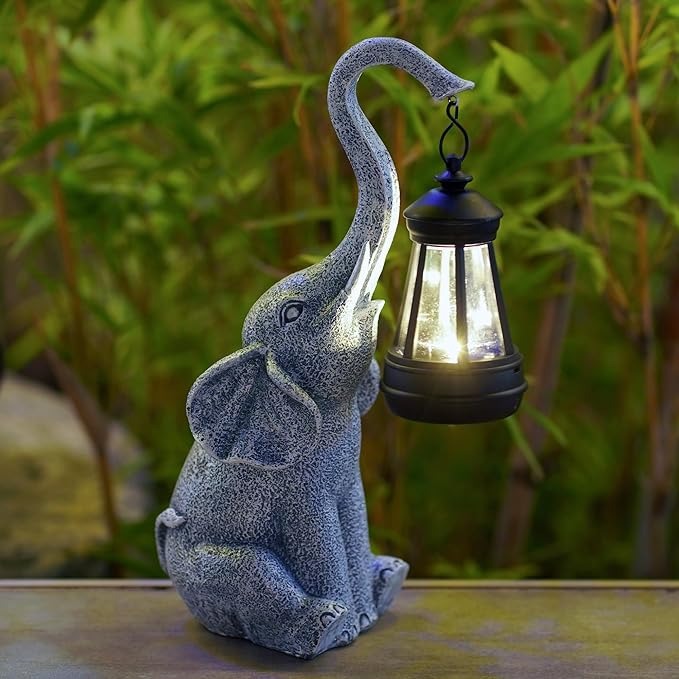 The solar powered elephant statue is suitable for garden decoration