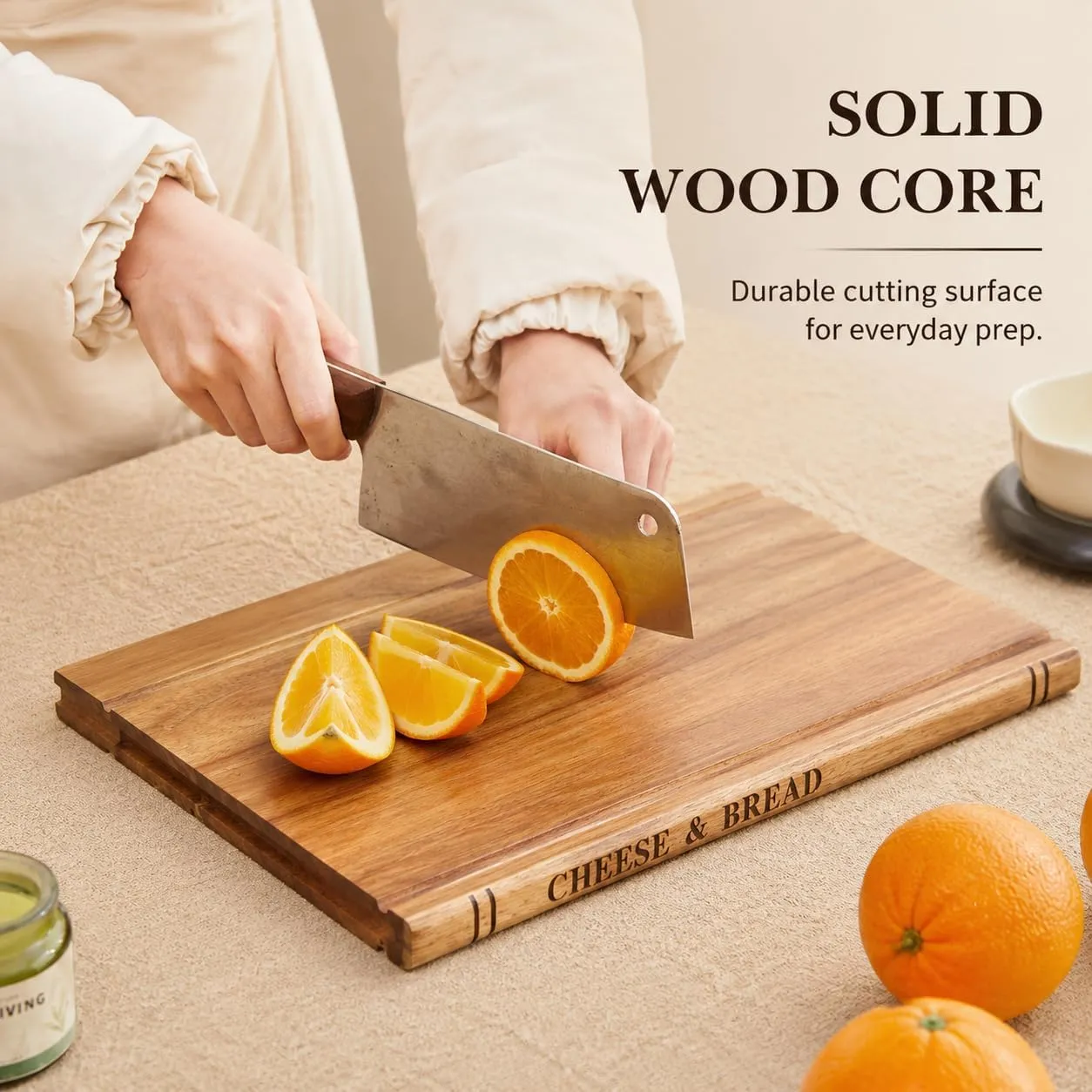 A person selecting one solid wood cutting board from the three-board set