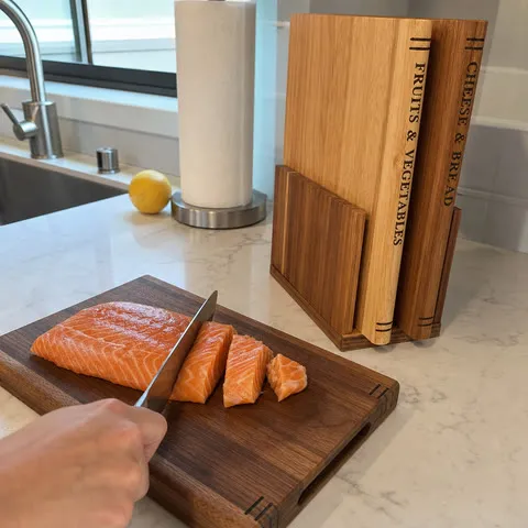 Dark solid wood board used during fish preparation