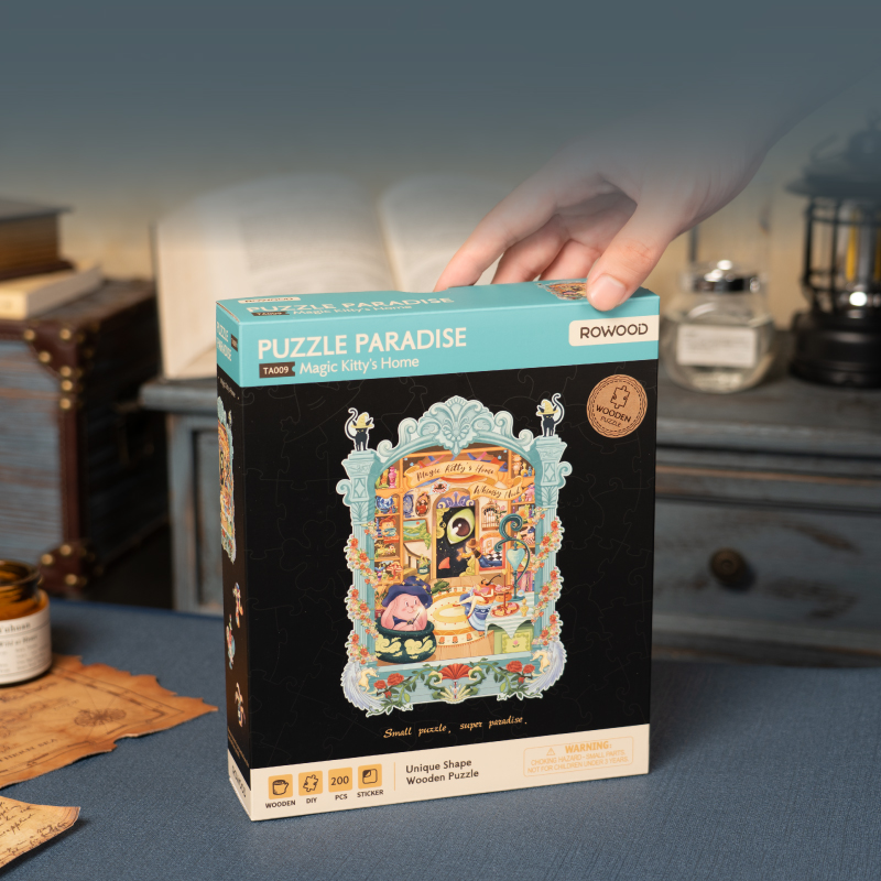Caja del producto junto al puzzle enmarcado — TA009