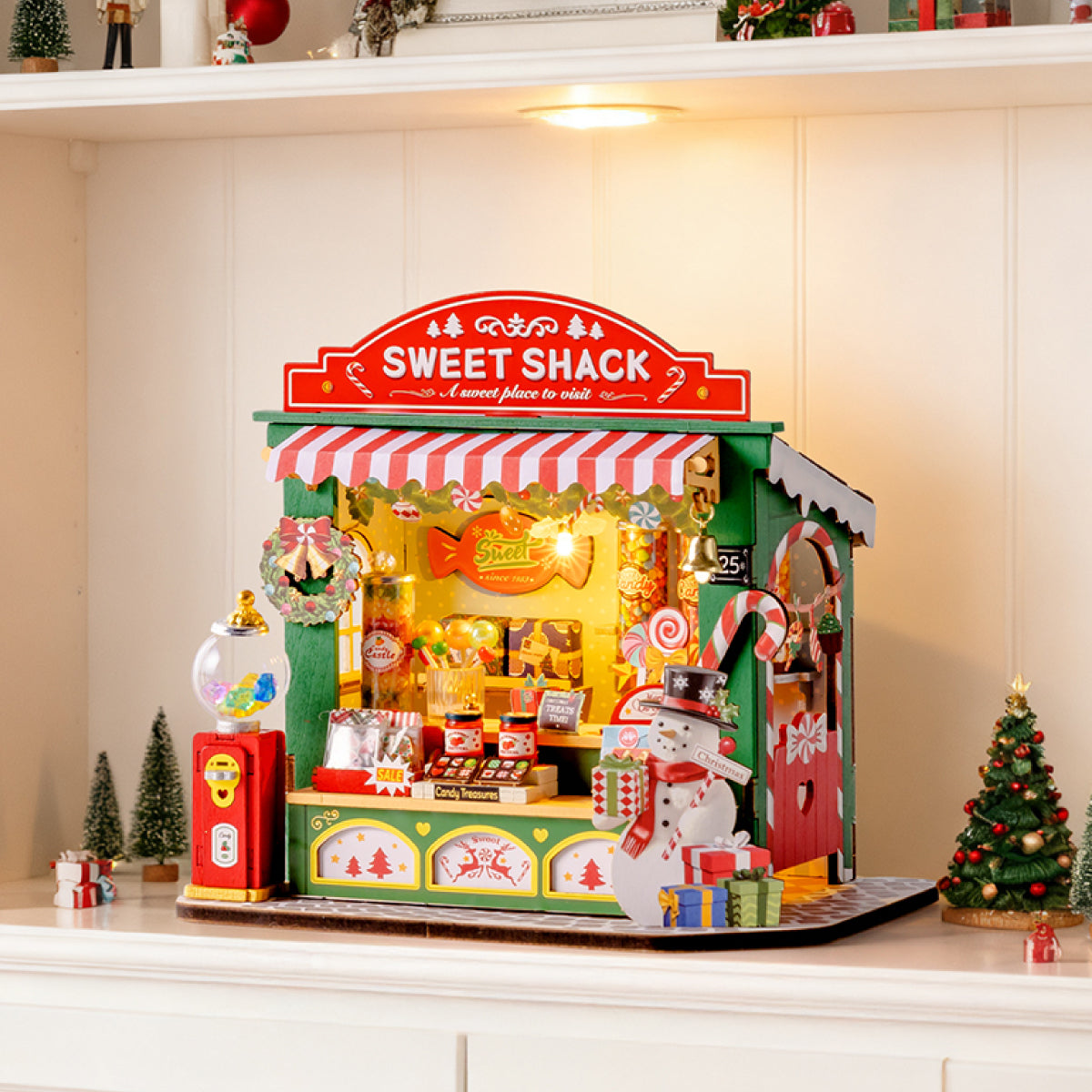 Scène d'affichage de table Christmas Candy Stand DS043 avec des lumières chaudes sur une étagère