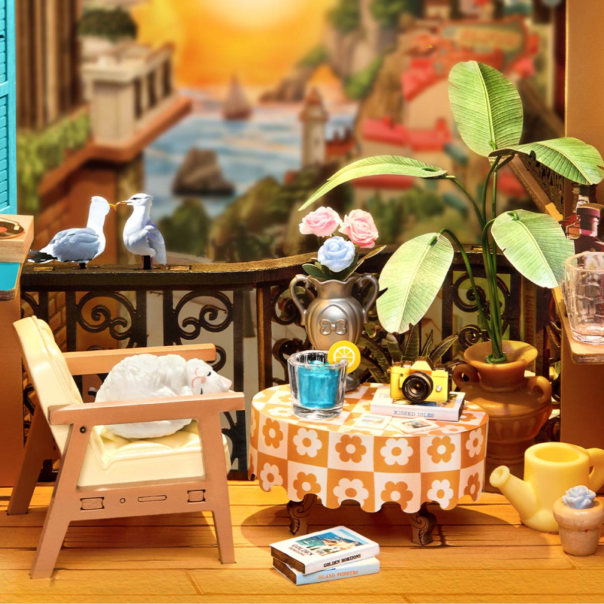 Rolife DIY Book Nook Kit Sunset Isle TGB18 Terrassentisch und Nahaufnahme einer schlafenden Katze