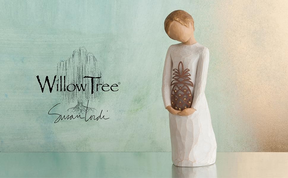 Willow Tree Gracious figure holding rust-colored, metal pineapple, decorated with gold-leaf dots.