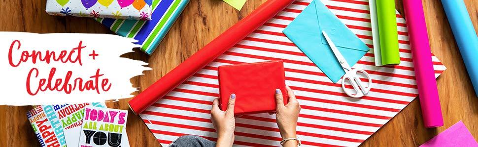 Connect and celebrate; woman sitting on the floor wrapping gifts