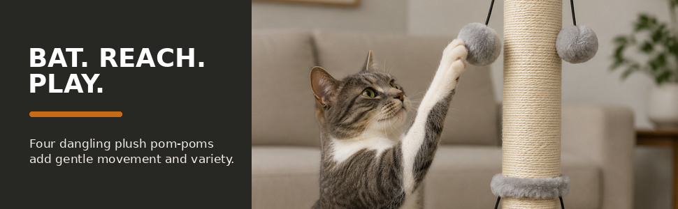Cat reaching toward a gray plush pom-pom