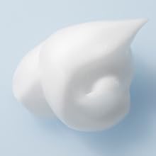 Pure/Clean blob of white foam on light blue background.