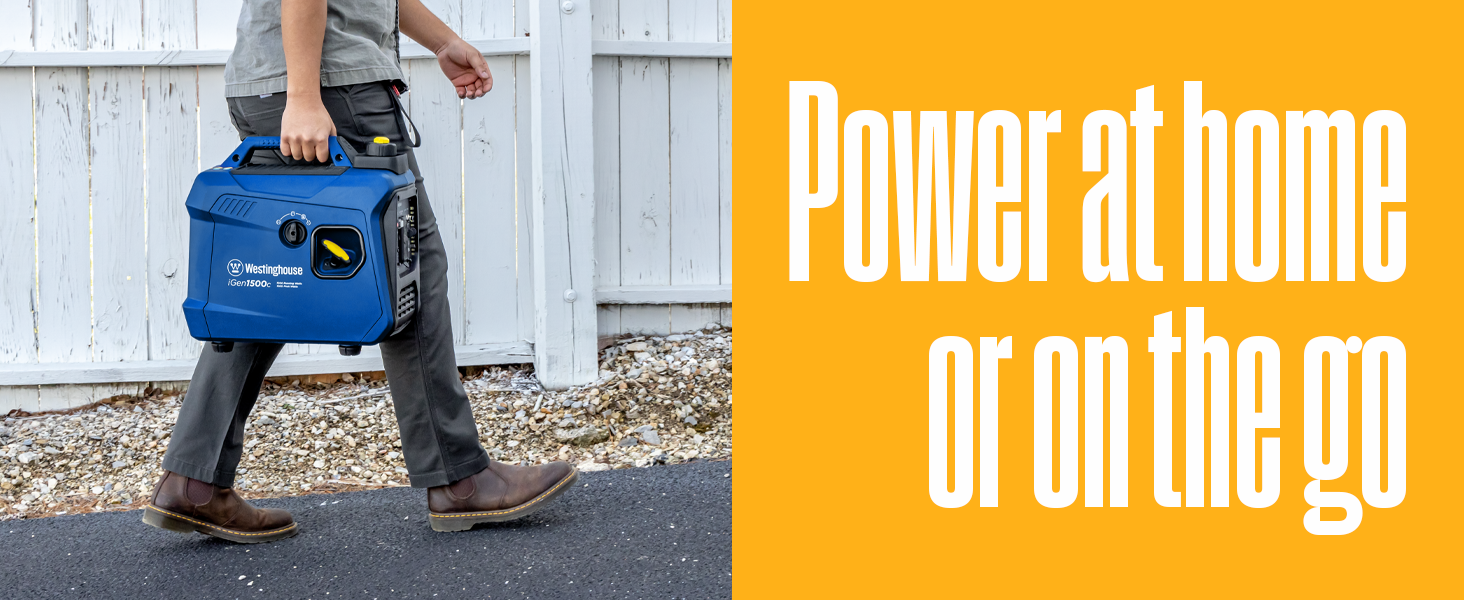 A person carries the iGen1500c portable generator while walking.