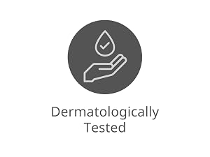 Text reads 'Dermatologically Tested.' Circular icon with water droplet and hand symbol on gray background, indicating dermatological safety certification for skincare product.