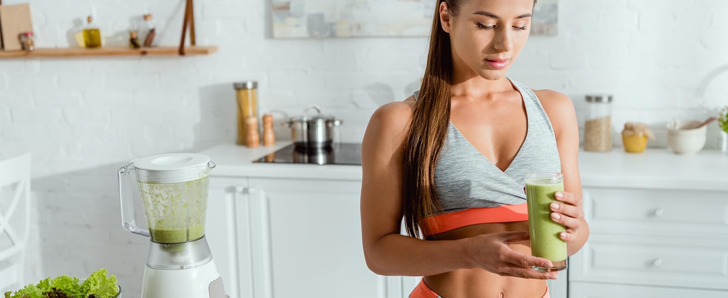 Whey Protein Isolate Powder Woman in Athletic Wear Making Healthy Smoothie