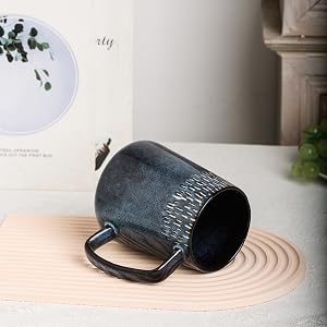 a cup of tea with a handle