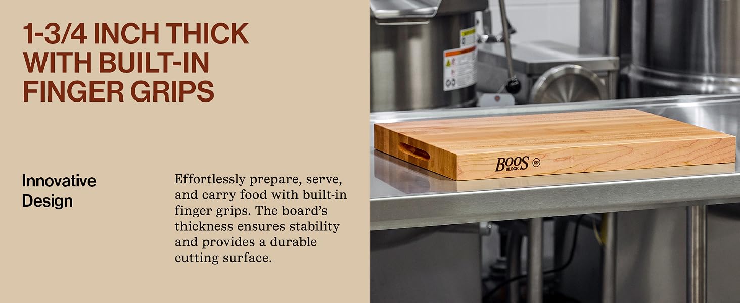 Wooden board on a stainless counter. Text reads: 1-3/4Inch Thick w/ built-in finger grips.