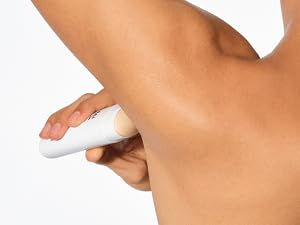 Native Deodorant glides smoothly as a man applies to his underarms.