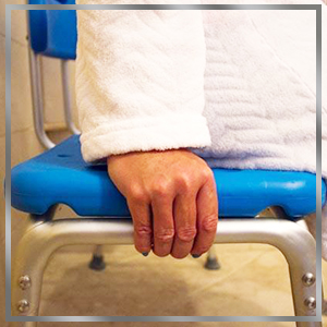 close-up on woman's hand fitting into integrated side handles of bench
