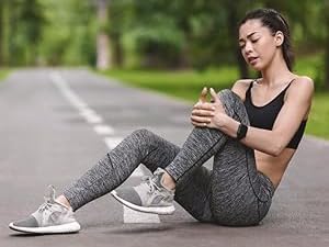 Women Holding Her Knee in Pain