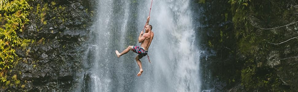 man swinging on rope
