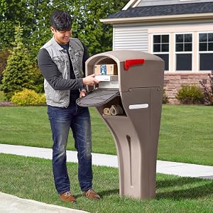 Man taking mail and small packages out of mailbox