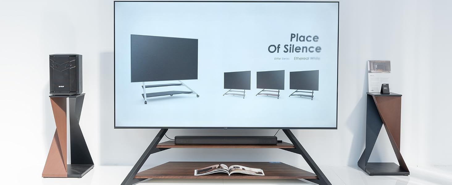 a living room with a television and speakers.