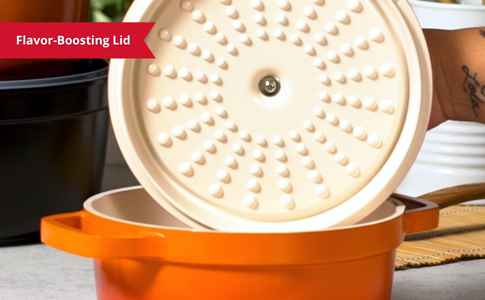 person opening a large pot for cooking to show condensation on the self basting top