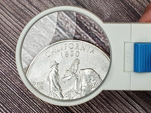 Magnifier Inspecting Coin Under Lens at 5x