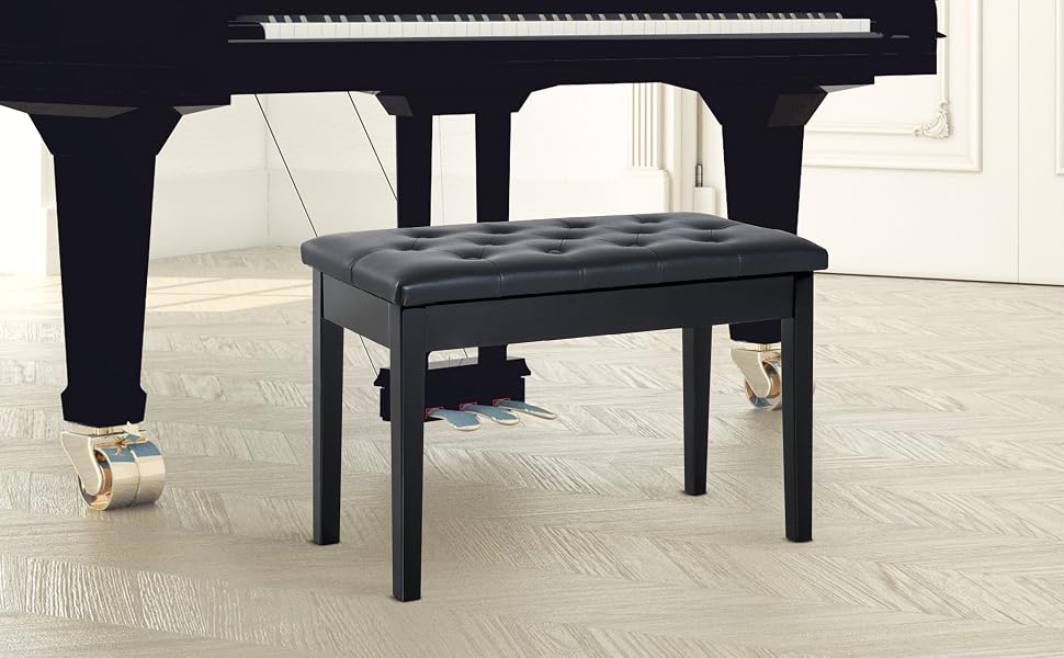 Black grand piano with matching adjustable piano bench. Piano features full keyboard visible, bench has padded seat and height adjustment mechanism for proper playing posture.