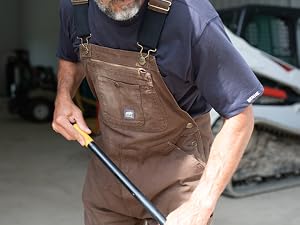 Man with unlined bib overalls working in berne apparel