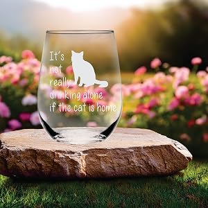 A stemless wine glass with a cat design
