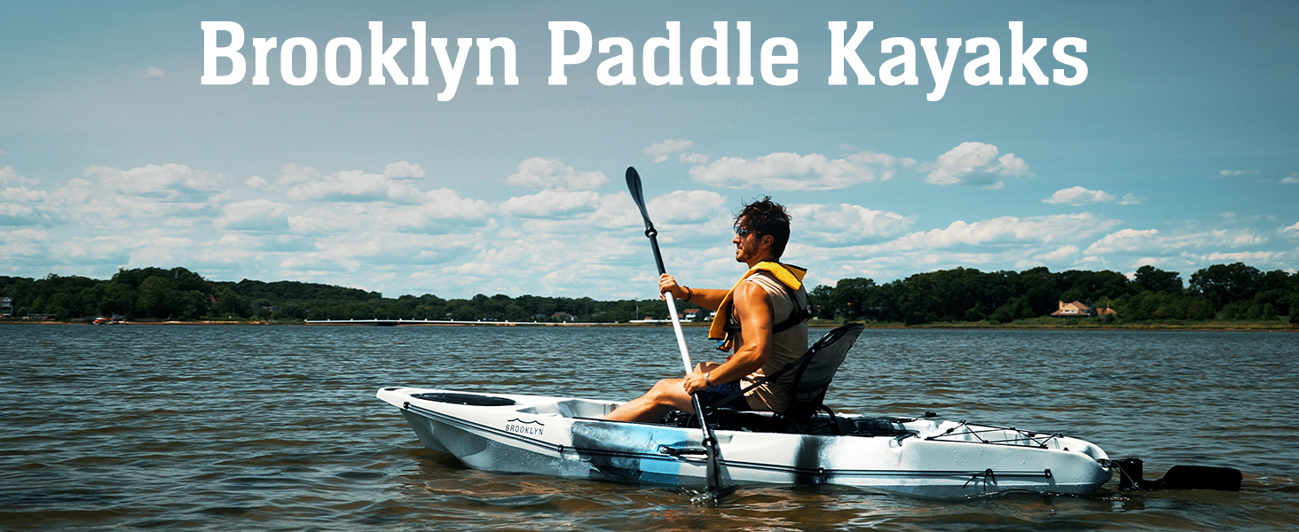 kayaker paddling on a lake in the summertime