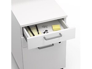 top view of open top drawer on white file cabinet