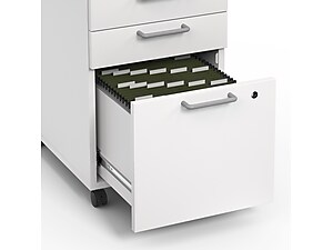 top view of open bottom drawer on white file cabinet