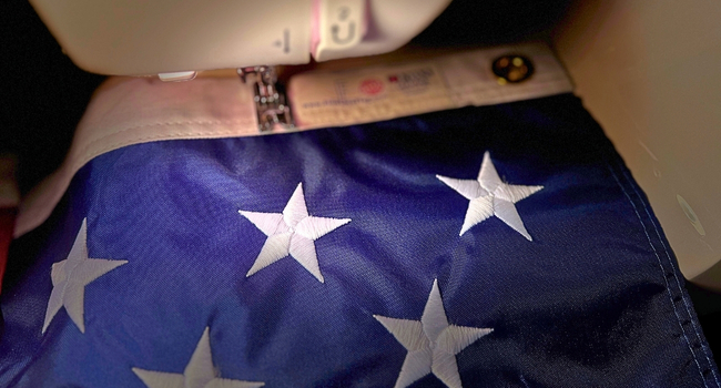 Close-up of embroidered stars on a 2x3 American flag made in the USA.