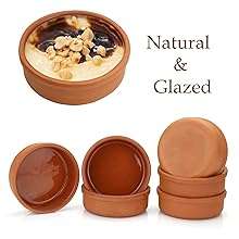 Mexican clay cookware set with terracotta pots, bowls and serving dishes for diverse cuisines.