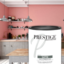 Can of satin paint in front of a picture of a pink kitchen