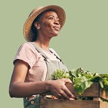 Female farmer carrying fresh greens