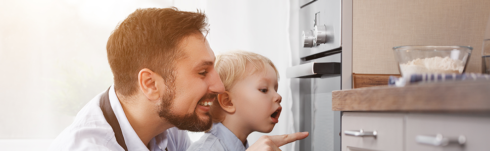 Man and boy stare at oven