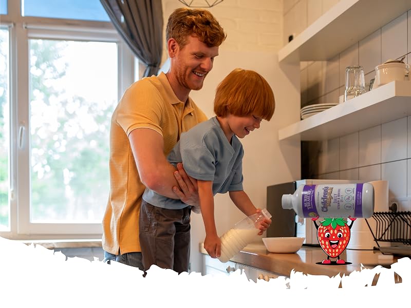 Father and son preparing breakfast, with cartoon strawberry holding a bottle of Children&amp;#39;s Daily