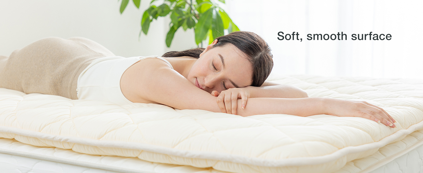Person resting on FULI futon with a soft, smooth surface