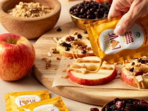 Spread The Love Organic Peanut Butter Single Serve Packet drizzle over apples