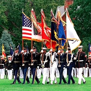 Military honor guard carrying flags in ceremonial parade